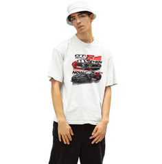 Person wearing a white t-shirt with a graphic design of a car and text.