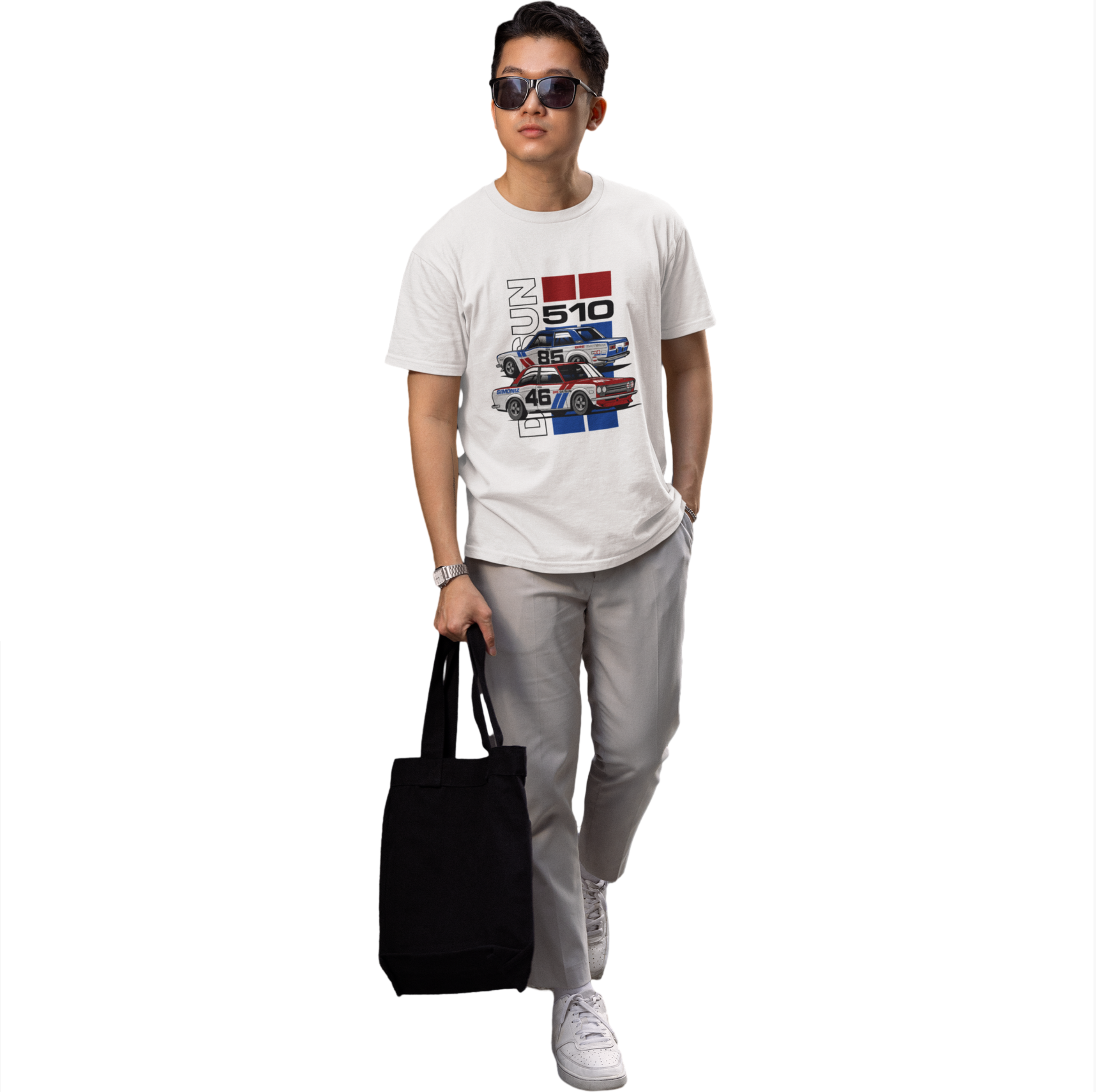 Person wearing a white t-shirt with graphic design, holding a black bag on a white background