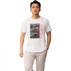 Man wearing a white t-shirt with a graphic design on a white background