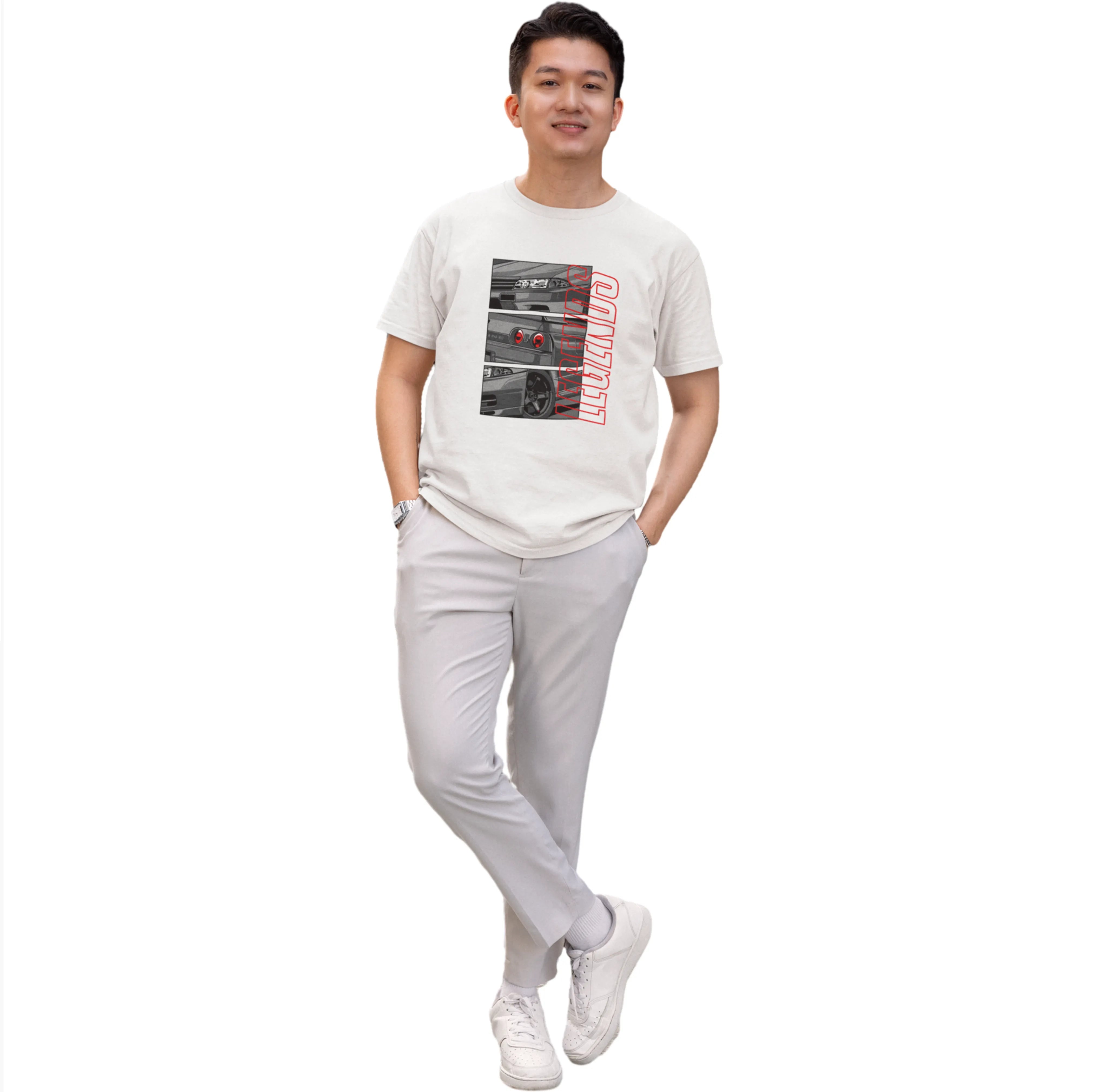 Person wearing a white t-shirt with graphic design and light gray pants on a white background