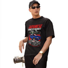 Person wearing a black t-shirt with car graphics and text on a white background