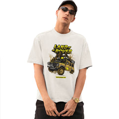 Person wearing a white t-shirt with Land Rover graphic on a white background