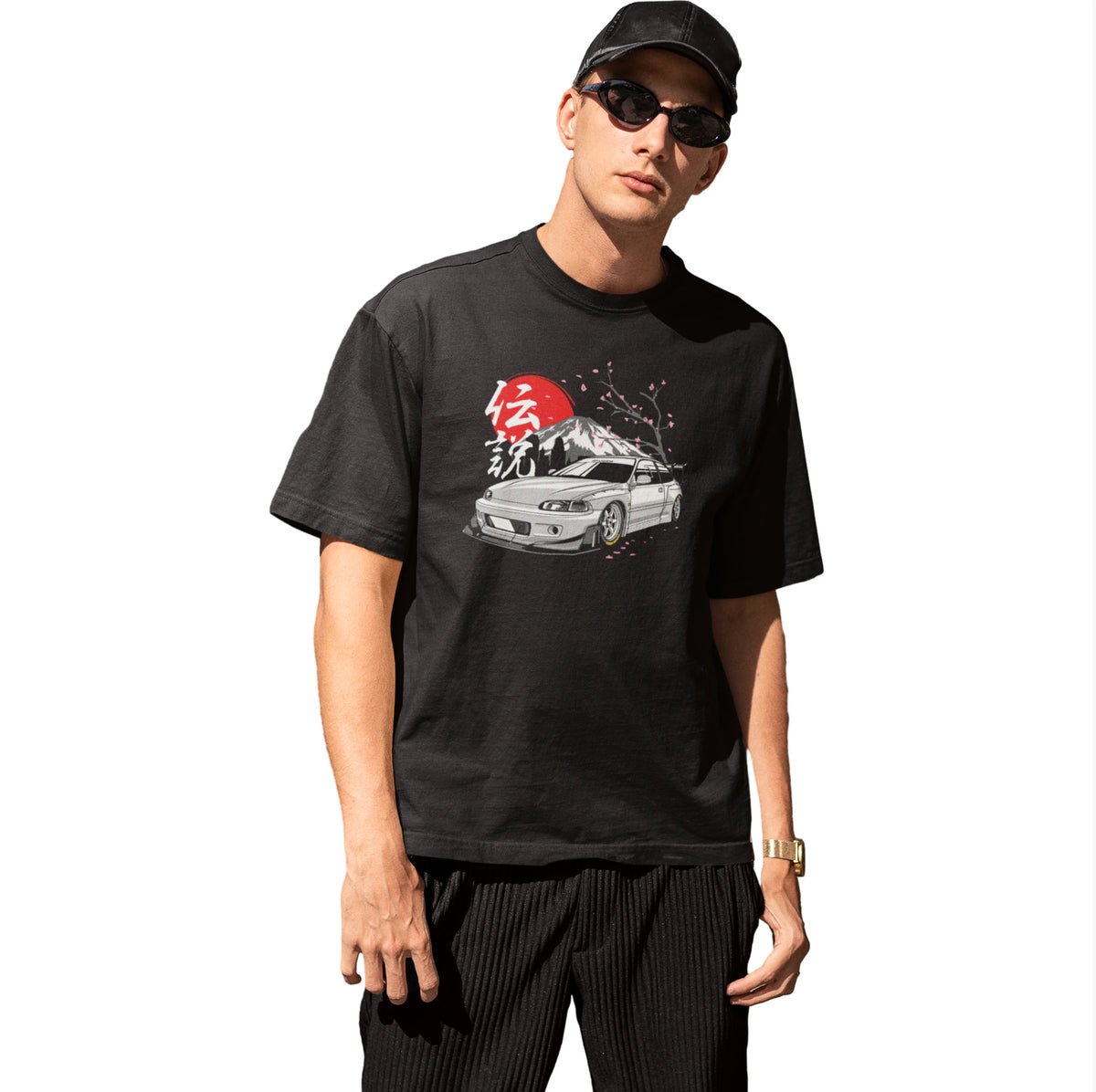 Person wearing a black t-shirt with a graphic design on a white background