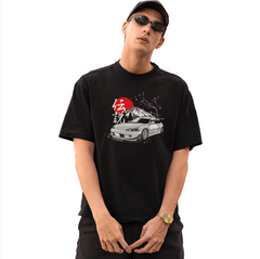 Person wearing a black t-shirt with a graphic design on a white background