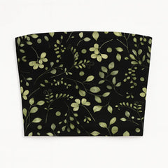 Fabric with green leaf pattern on a black background