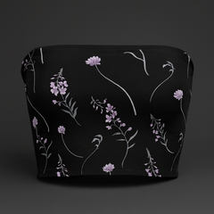Black pouch with floral pattern on a dark background