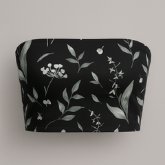 Black bandeau top with floral pattern on a gray background