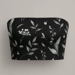 Black pouch with white floral pattern on a gray background
