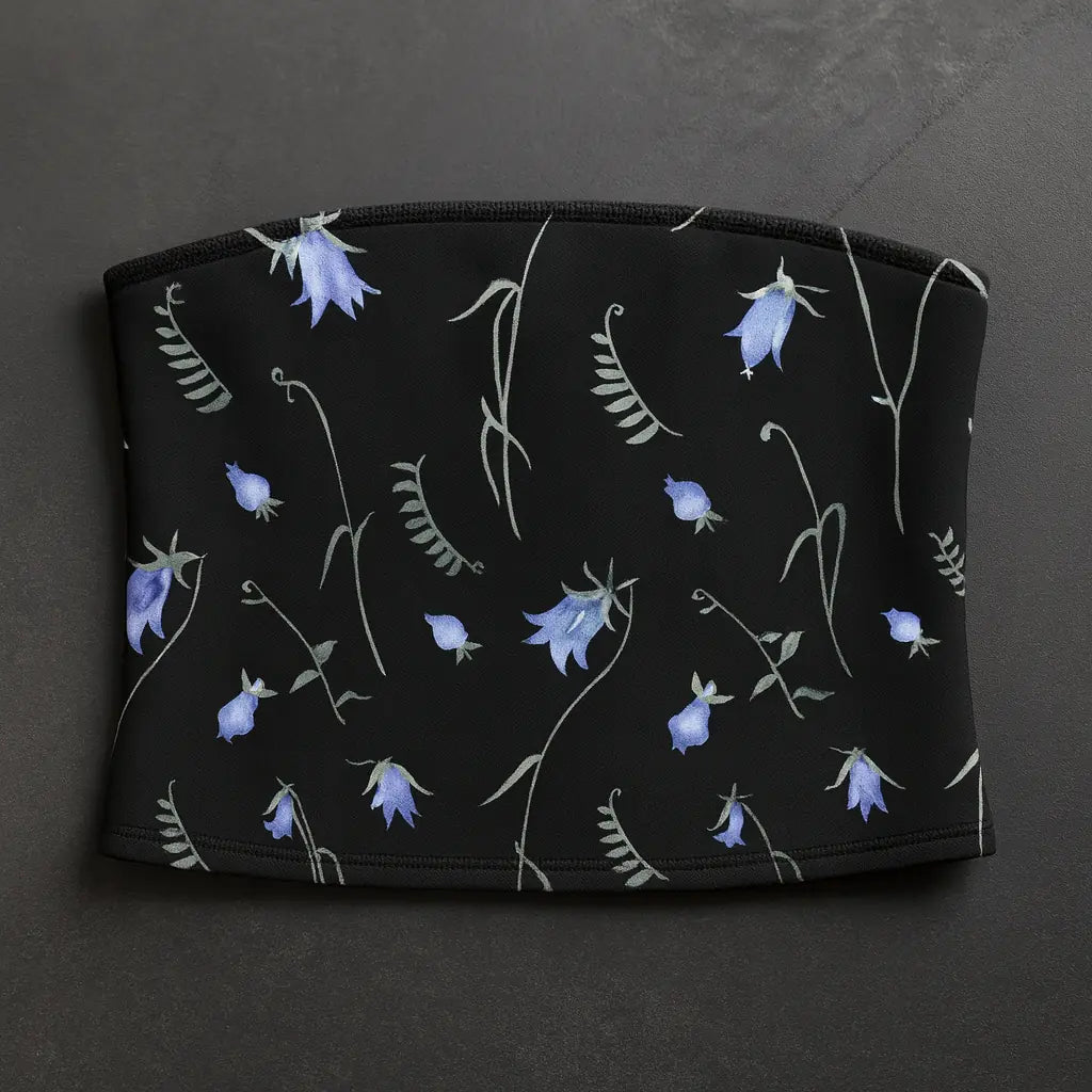 Black pouch with blue floral pattern on a dark gray background