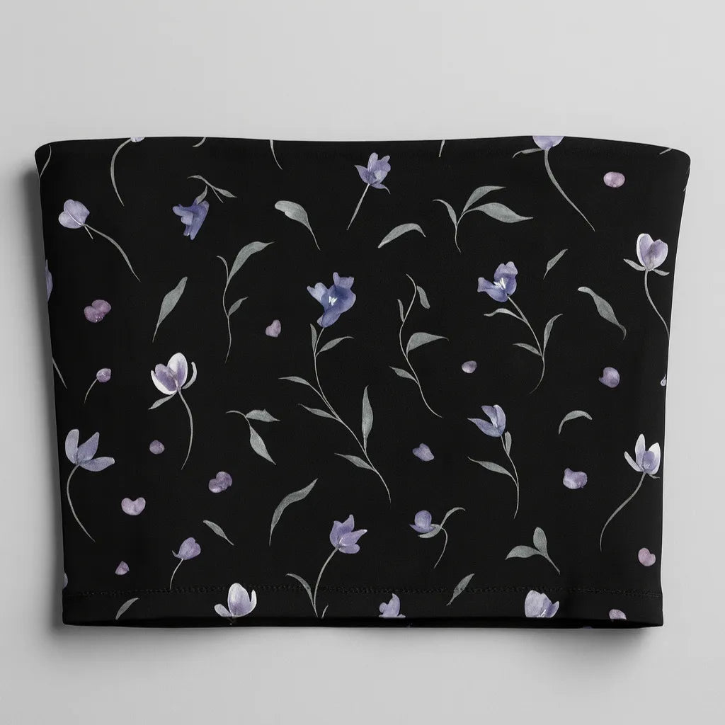 Black tube top with floral pattern on a light gray background