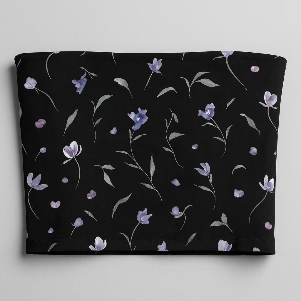 Black tube top with floral pattern on a gray background