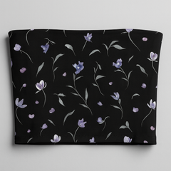 Black tube top with floral pattern on a gray background