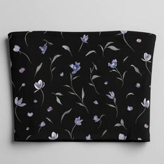 Black tube top with floral pattern on a light gray background