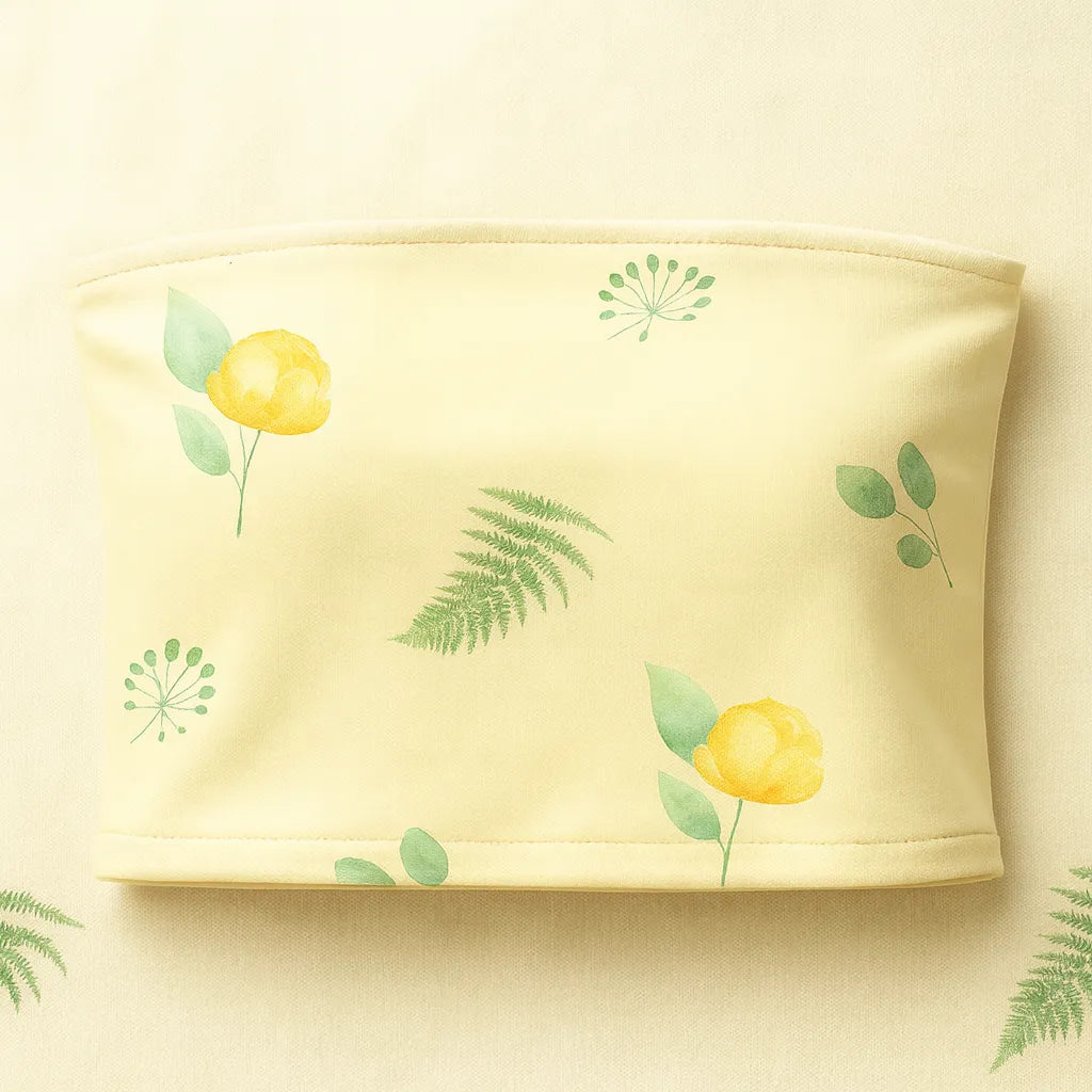 Yellow tube top with floral patterns on a matching background