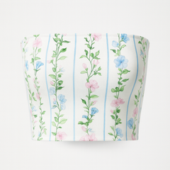 Floral-patterned cylindrical container on a white background