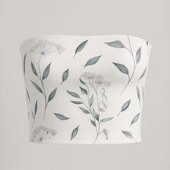White strapless top with floral pattern on a gray background