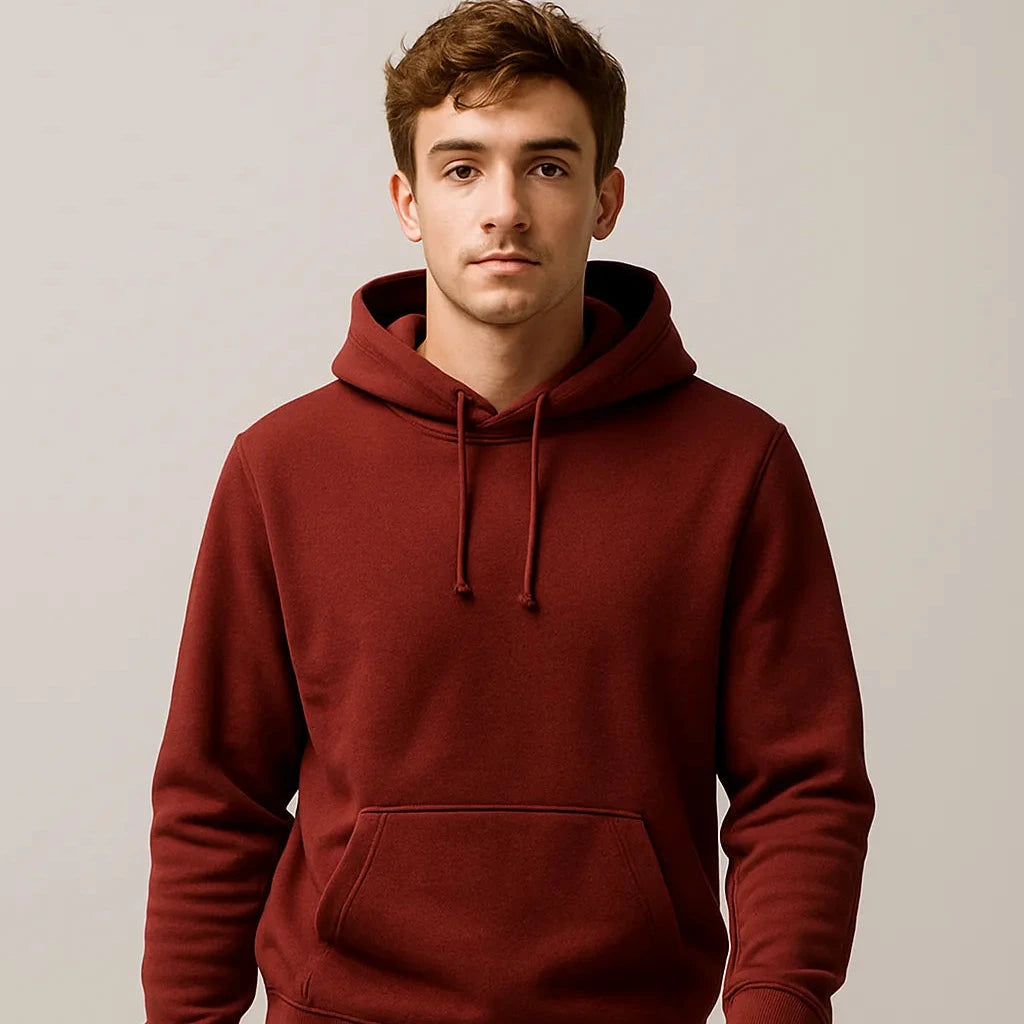 Man wearing a red hoodie against a plain background