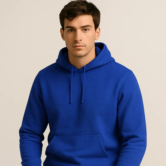 Man wearing a blue hoodie on a beige background