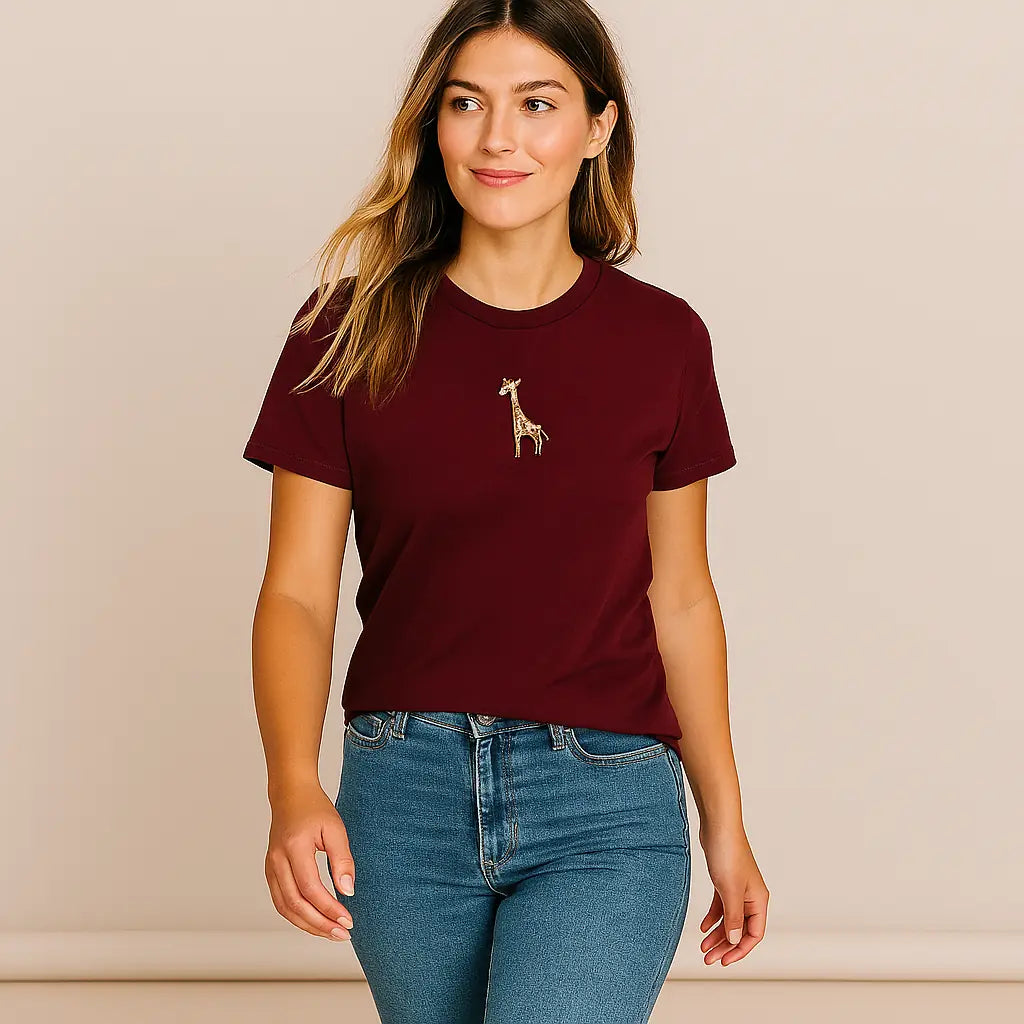 Woman wearing a burgundy t-shirt with a giraffe graphic on a beige background