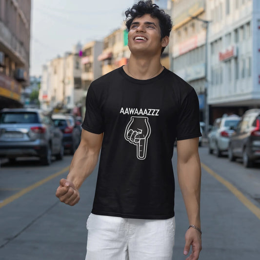 Man wearing a black t-shirt with text and graphic on a city street