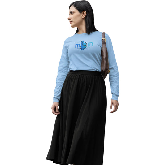 Woman wearing a light blue sweater with a logo and a black skirt on a white background