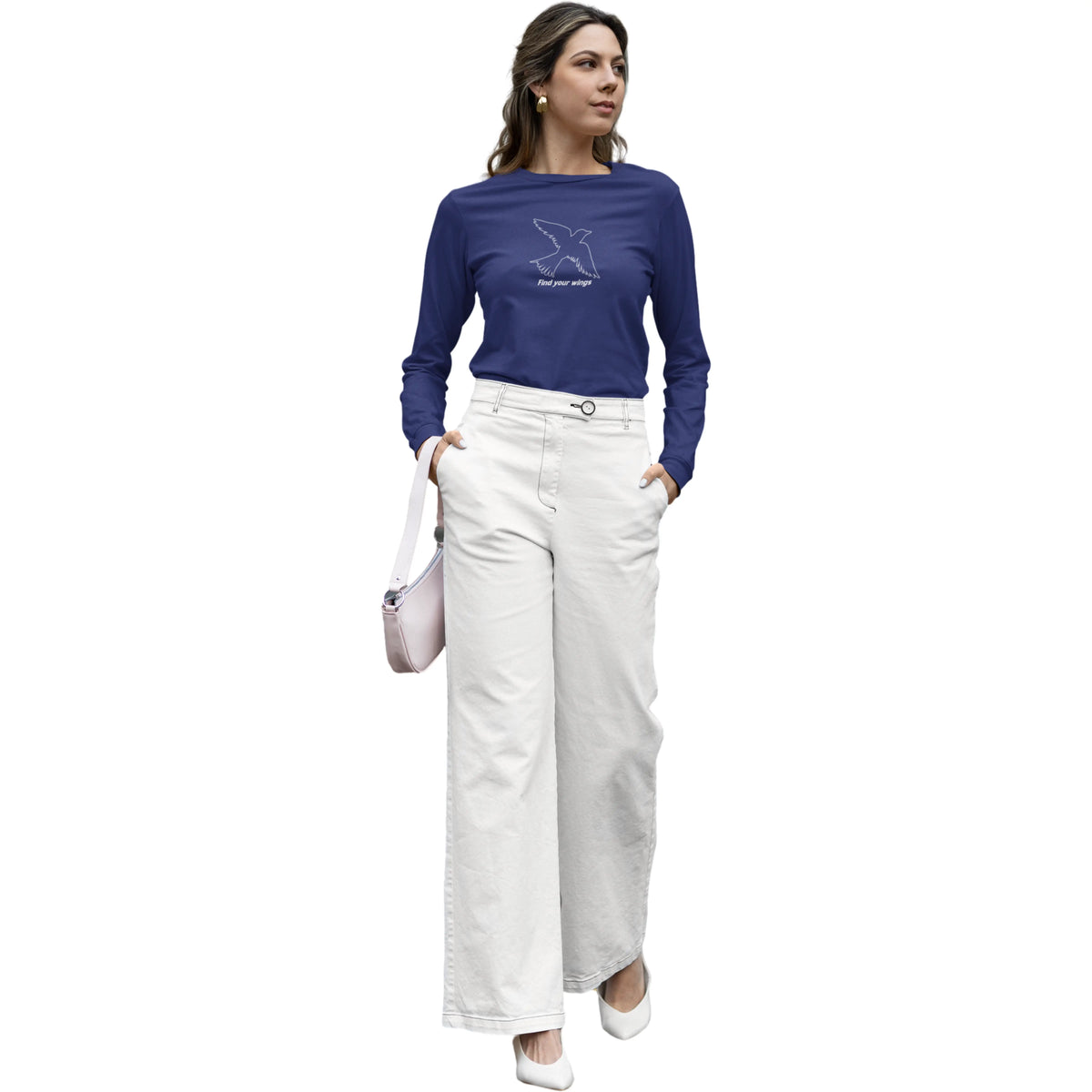 Woman wearing a blue long-sleeve shirt and white pants on a white background