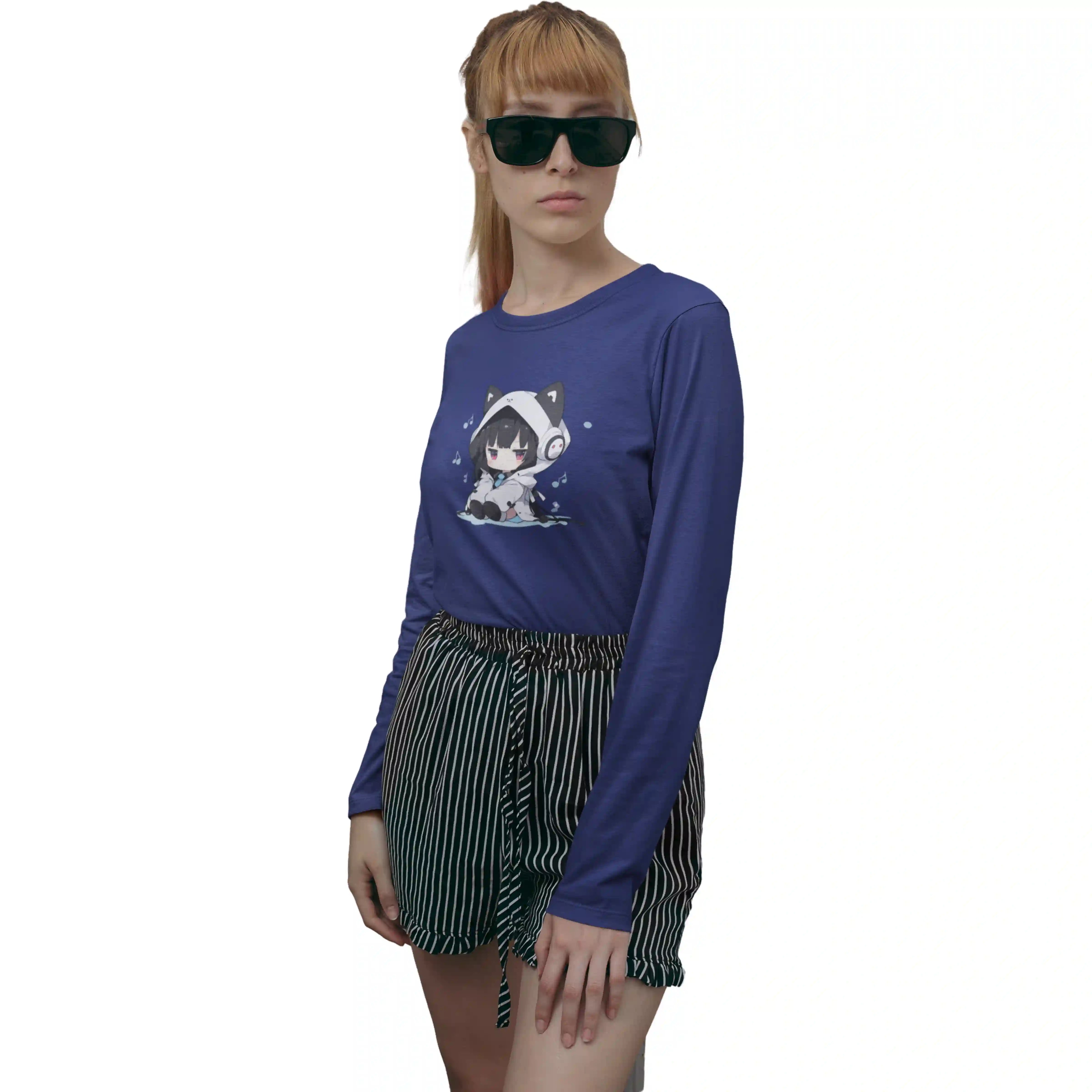 Person wearing a blue long-sleeve shirt with a graphic design and black shorts on a white background