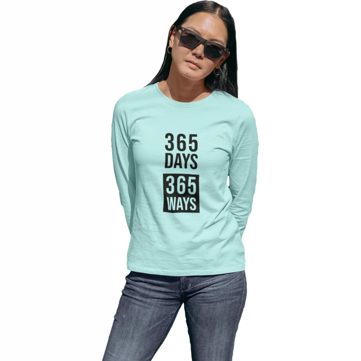 Person wearing a light blue long-sleeve shirt with text on a white background