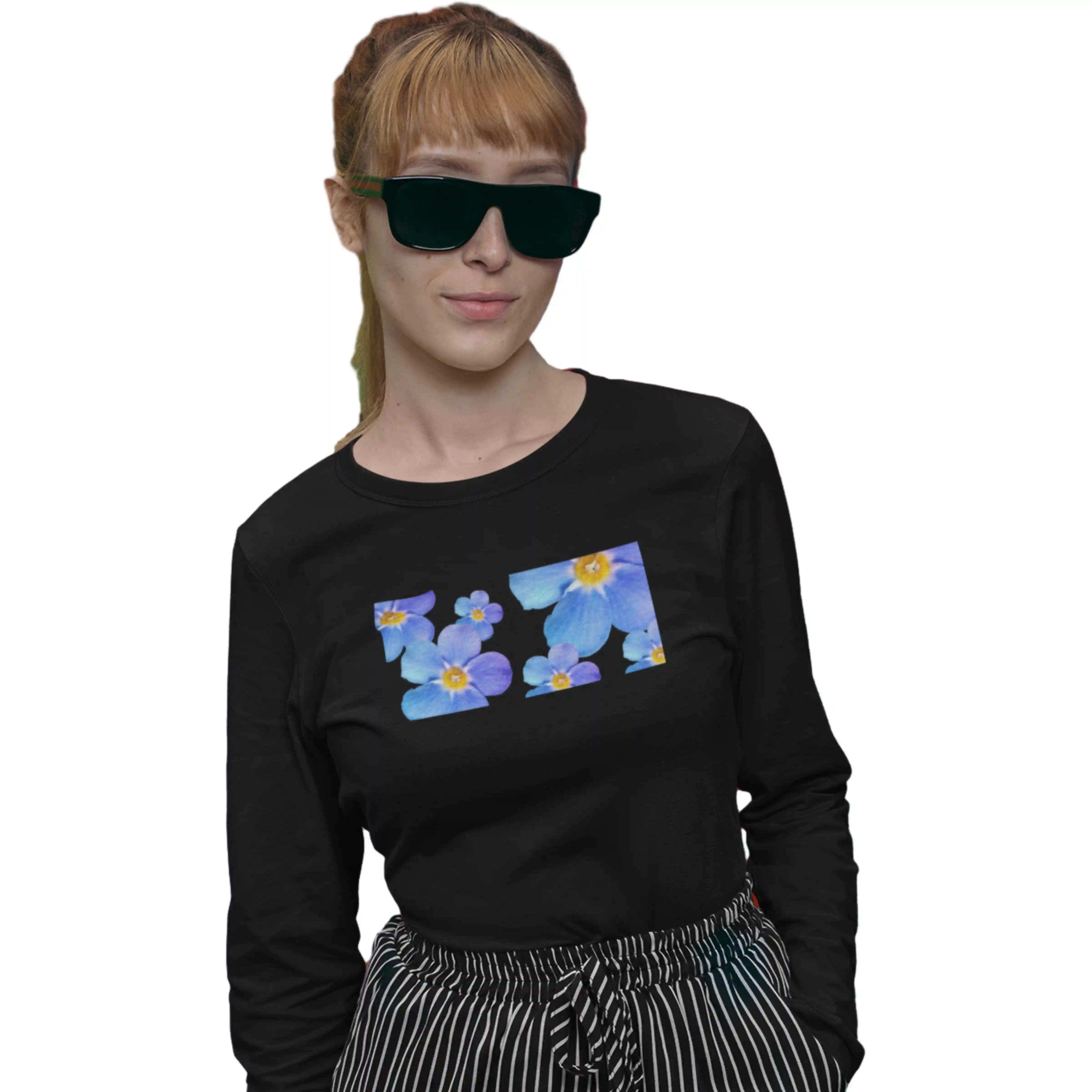 Person wearing a black long-sleeve shirt with a colorful floral design on a white background