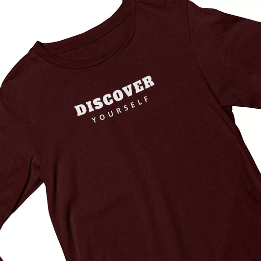 Maroon t-shirt with 'DISCOVER YOURSELF' text on a white background