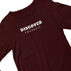 Maroon t-shirt with 'DISCOVER YOURSELF' text on a white background