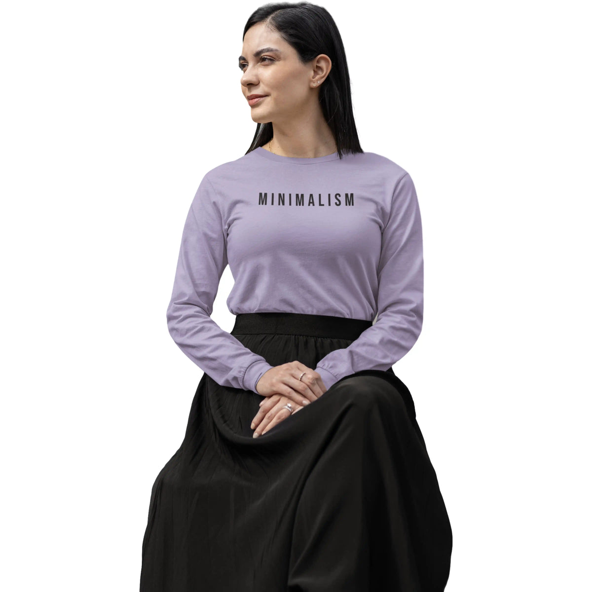 Woman wearing a purple long-sleeve shirt with 'MINIMALISM' text on a white background