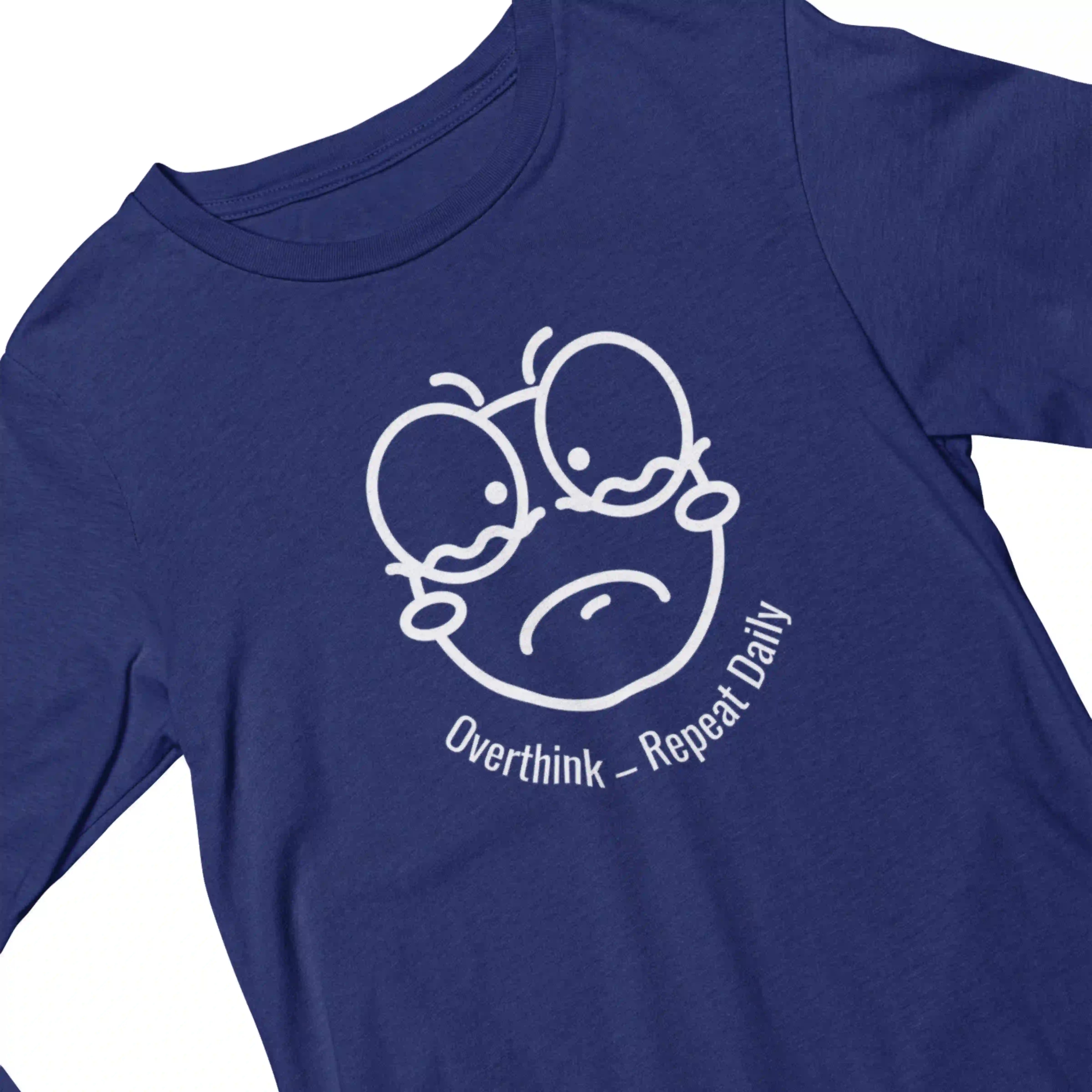 Blue t-shirt with a white graphic and text 'Overthink - Repeat Daily' on a white background