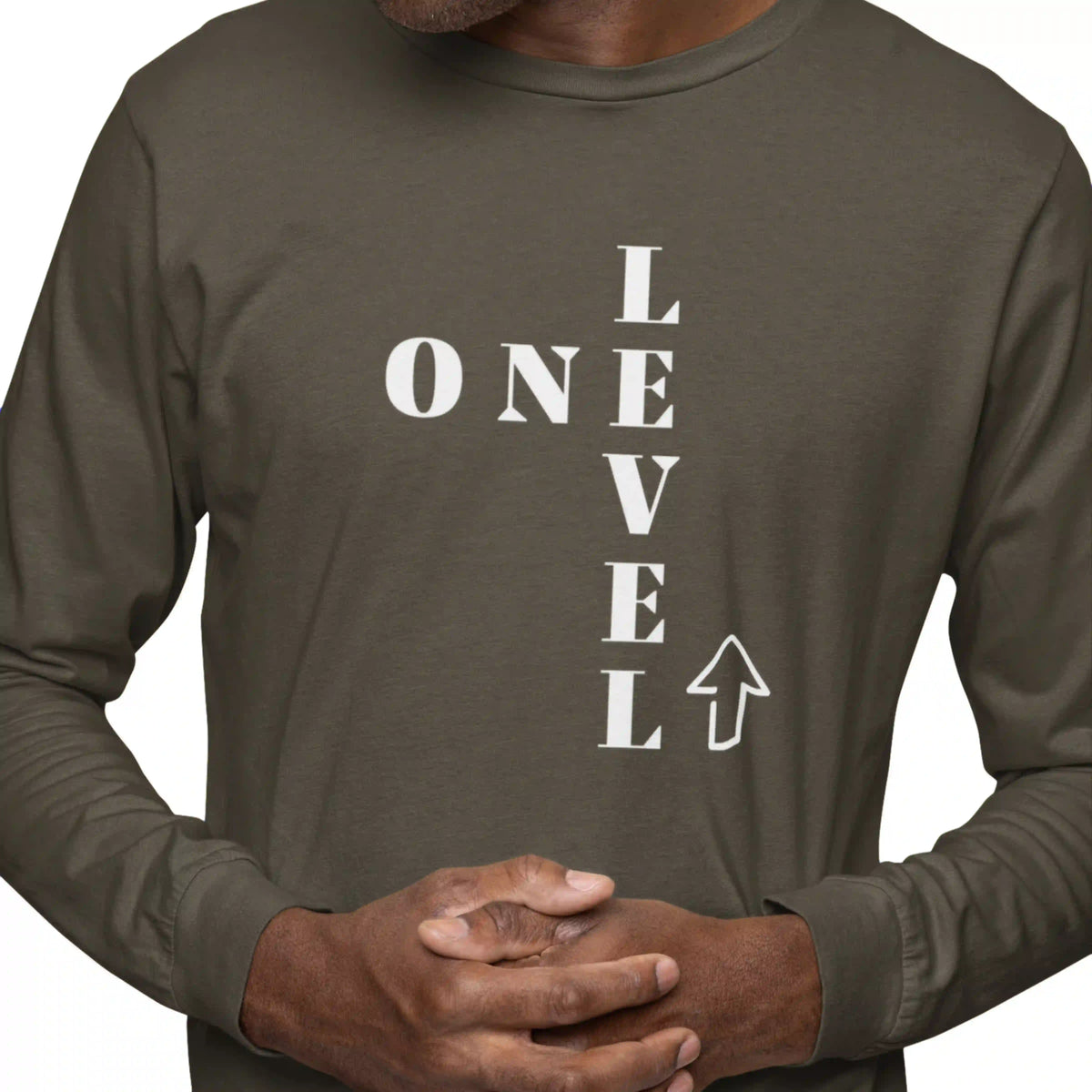 Person wearing a dark green long-sleeve shirt with 'ONE LEVEL' text design.