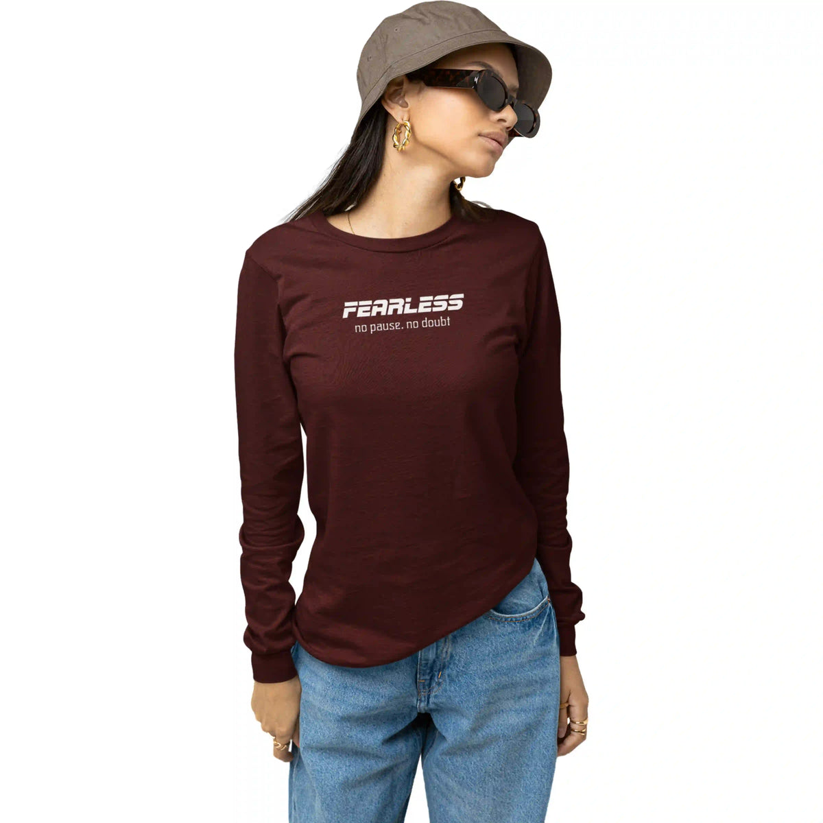 Person wearing a maroon long-sleeve shirt with 'Fearless no pause, no doubt' text on a white background