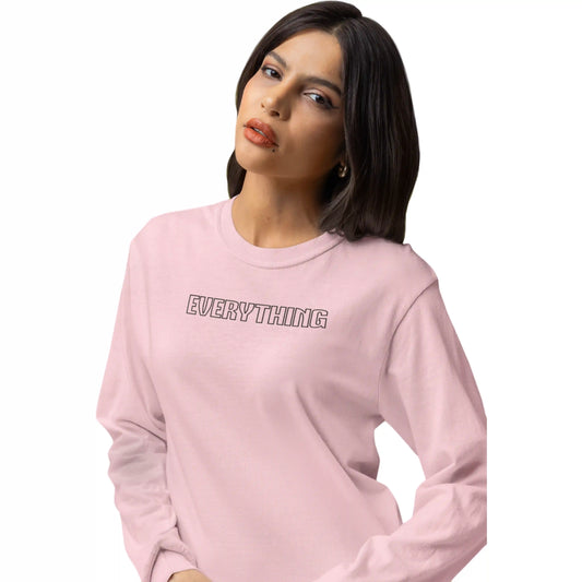 Woman wearing a pink sweatshirt with 'EVERYTHING' text on a white background