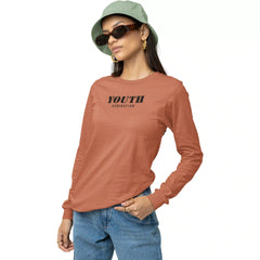 Person wearing a brown long-sleeve shirt with 'YOUTH' text, blue jeans, and a green bucket hat on a white background.