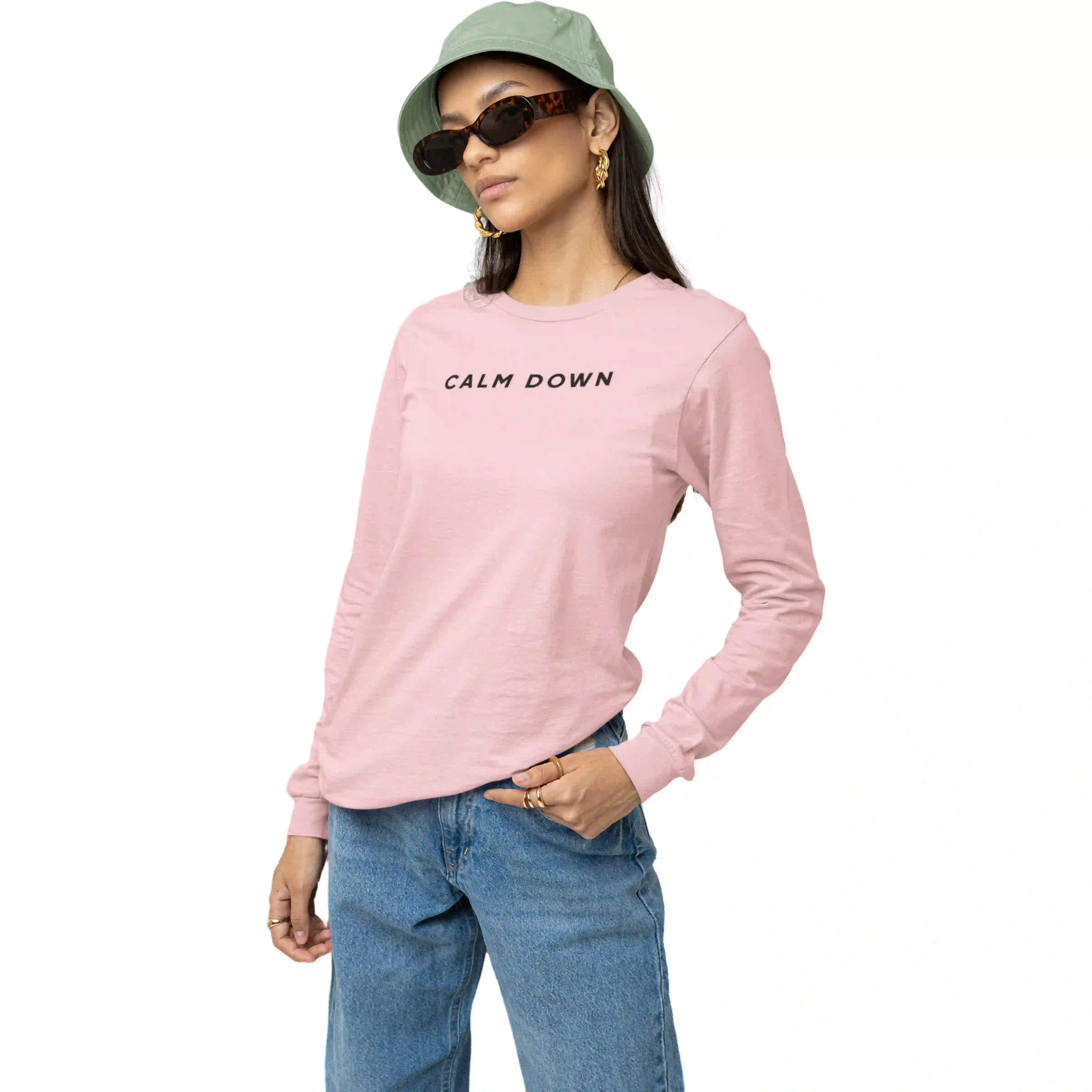 Person wearing a pink long-sleeve shirt with 'CALM DOWN' text, blue jeans, and a green bucket hat on a white background.