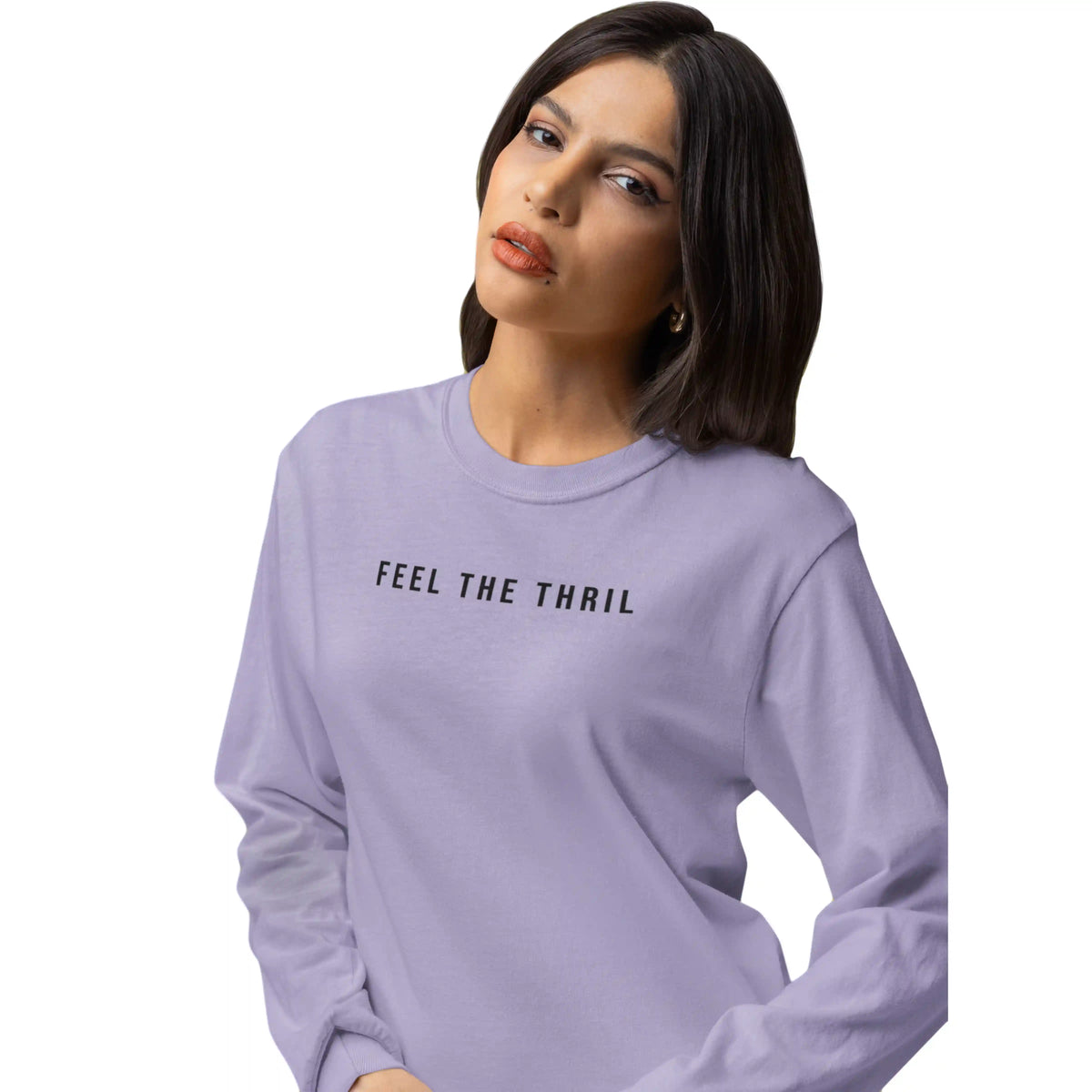 Woman wearing a lavender sweatshirt with 'FEEL THE THRIL' text on a white background