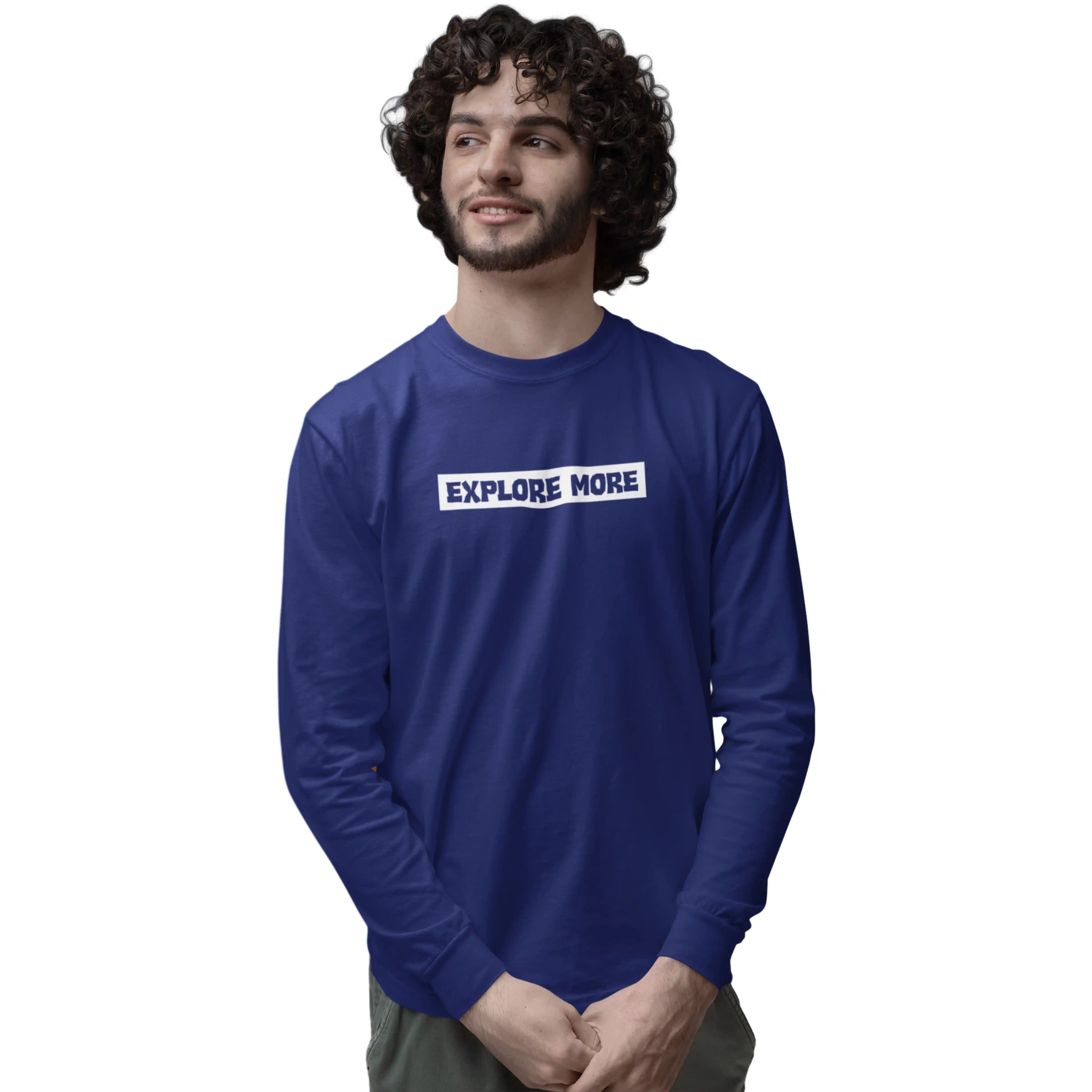 Man wearing a blue long-sleeve shirt with 'EXPLORE MORE' text on a white background