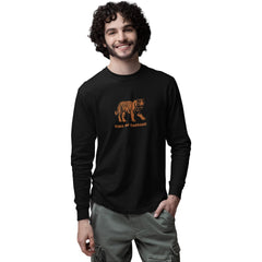 Man wearing a black long-sleeve shirt with a tiger graphic and text on a white background