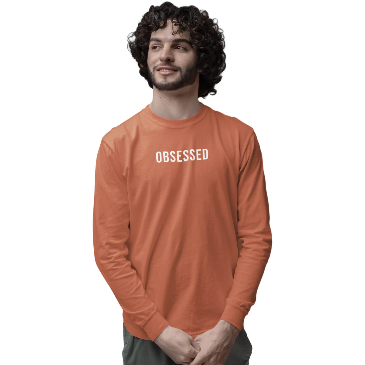 Man wearing an orange long-sleeve shirt with 'OBSESSED' text on a white background