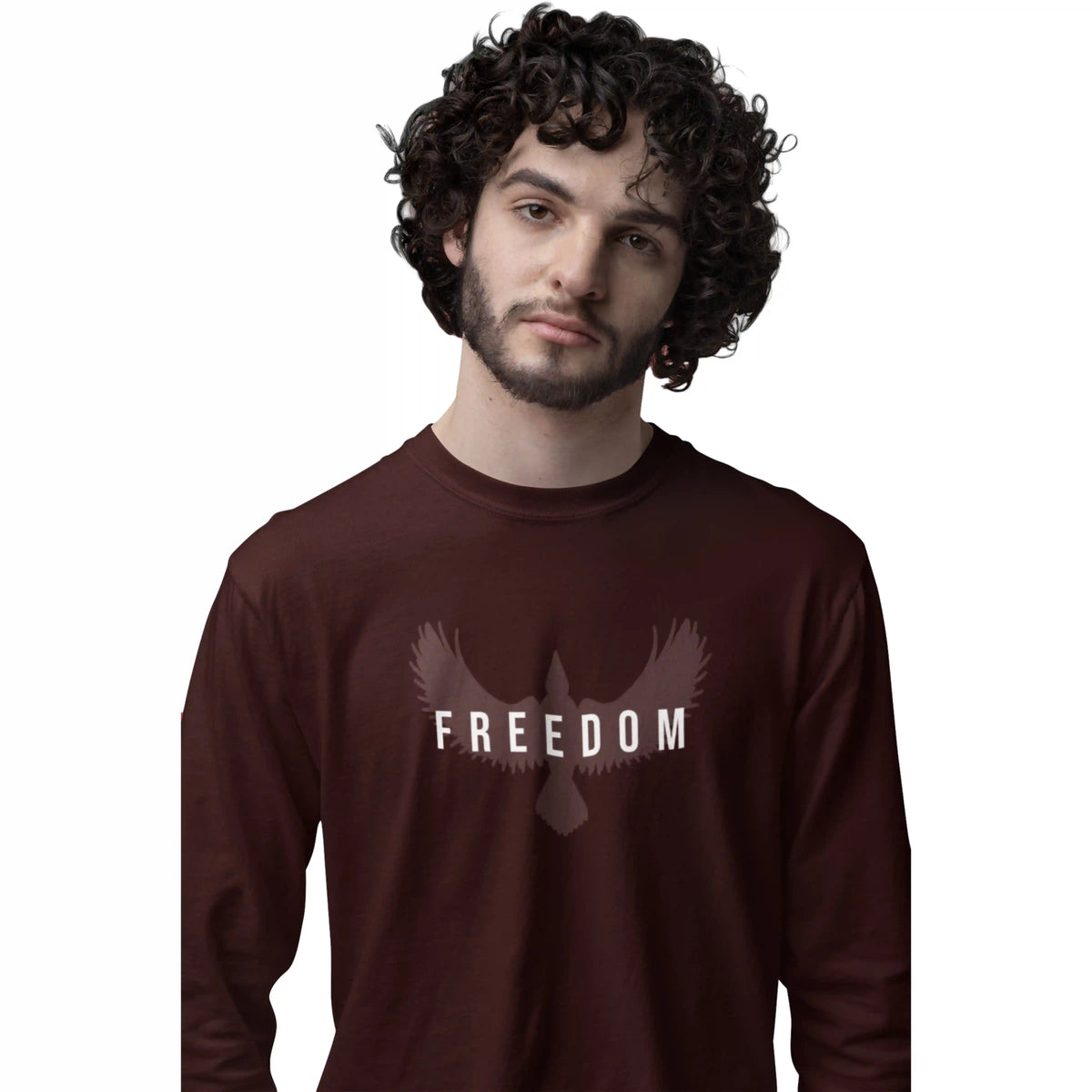 Man wearing a brown long-sleeve shirt with 'FREEDOM' and dove design on a white background