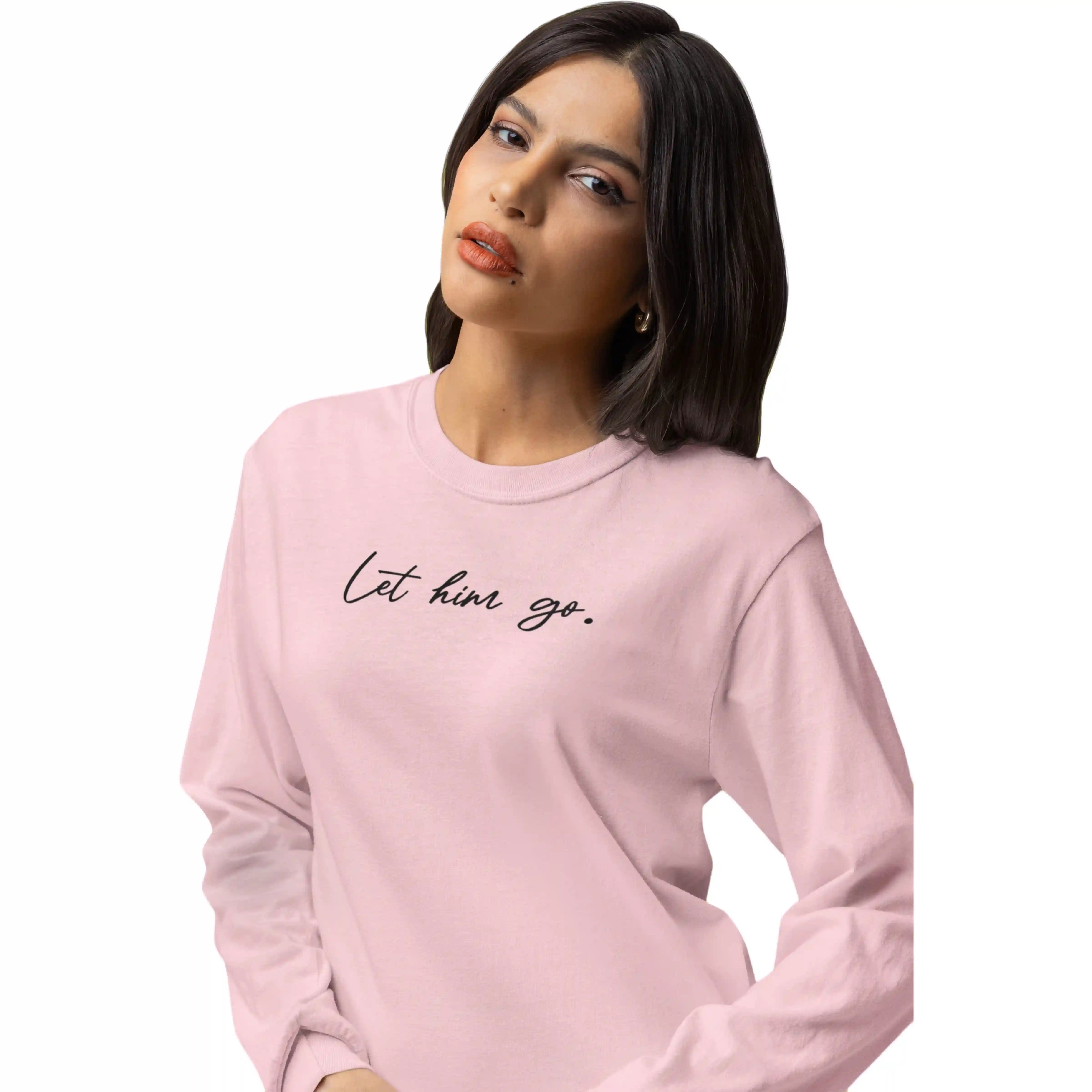 Woman wearing a pink sweatshirt with 'Let him go.' text on a white background