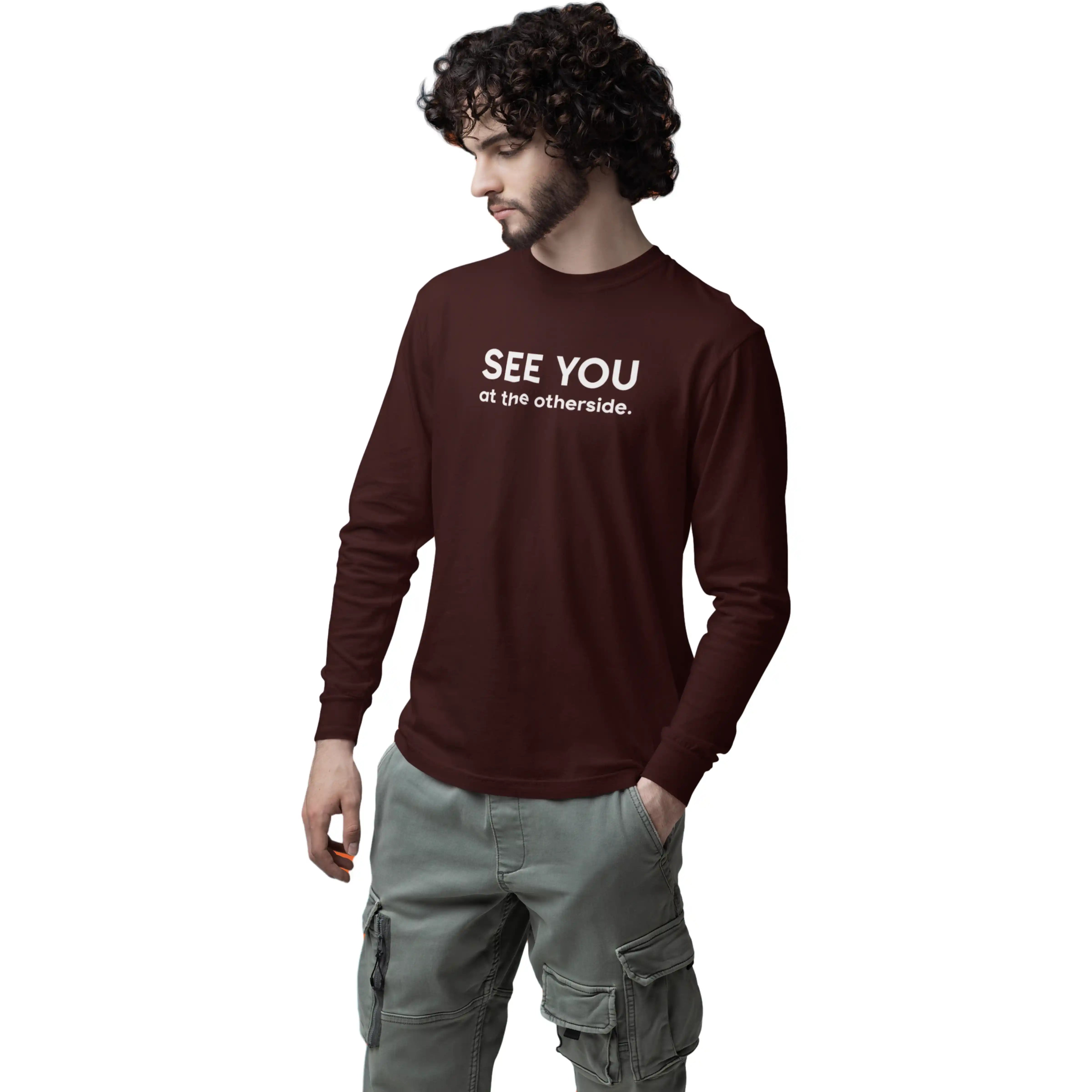 Man wearing a maroon sweatshirt with 'SEE YOU at the otherside.' text on a white background