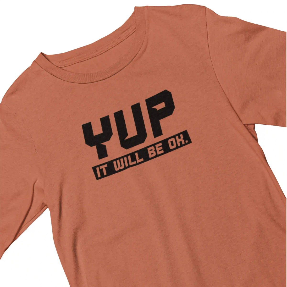 Orange t-shirt with black text 'YUP IT WILL BE OK.' on a white background