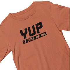 Orange t-shirt with black text 'YUP IT WILL BE OK.' on a white background