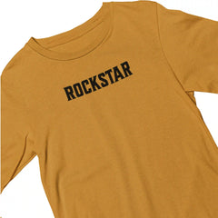 Mustard yellow t-shirt with 'ROCKSTAR' text on a white background