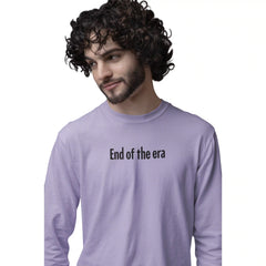 Man wearing a purple long-sleeve shirt with 'End of the era' text on a white background
