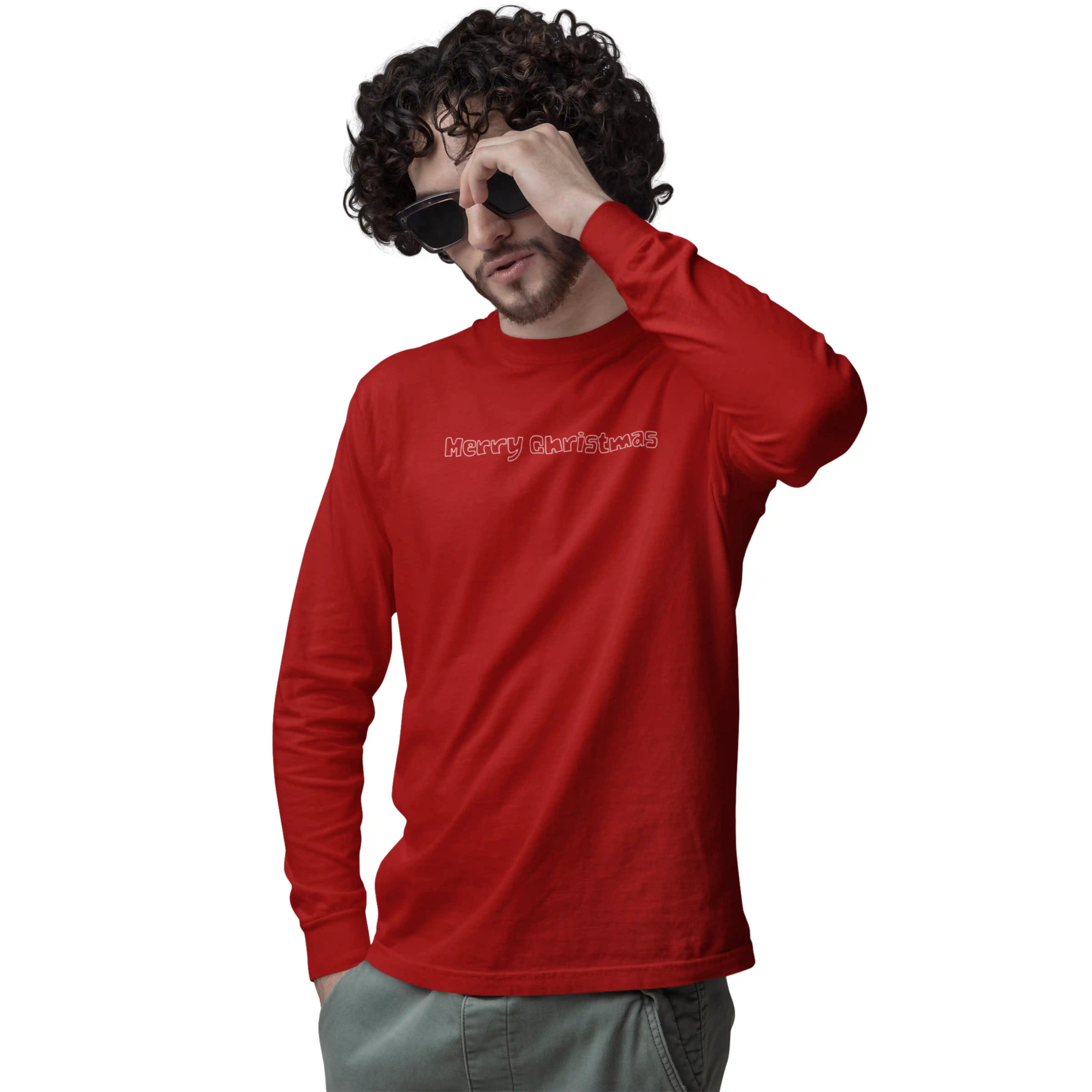 Man wearing a red long-sleeve shirt with text, holding sunglasses to his face on a white background